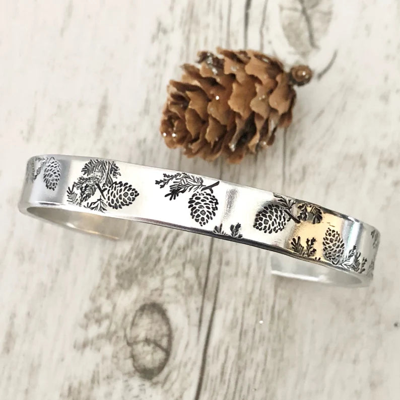 Hand Stamped Pine Cone cuff by April Hylton Designs 🇨🇦